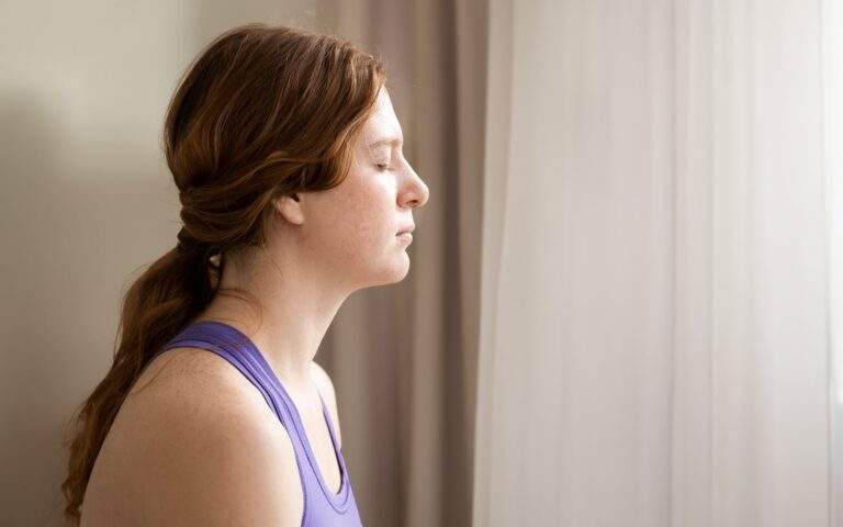 A 12-Minute Meditation to Act on What's Important-Photo of a woman sitting in meditation.